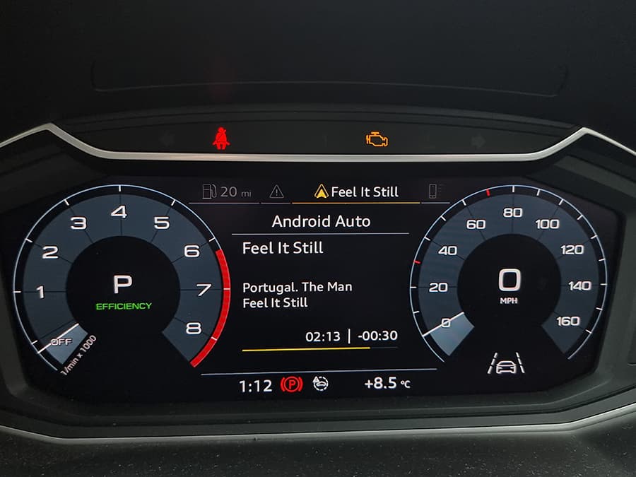 A car dashboard, showing revs, miles per hour, and the car's current entertainment: android auto.