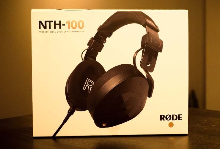 The NTH-100 headphones box placed upright on a wooden table.