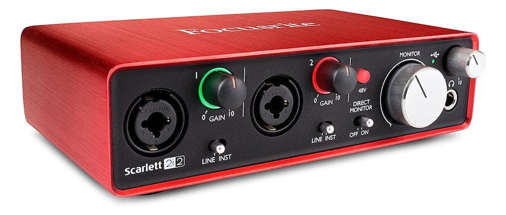 ALT: The Focusrite Scarlett 2i2, a red boxed shape audio interface with various dial controls on the front of the interface.