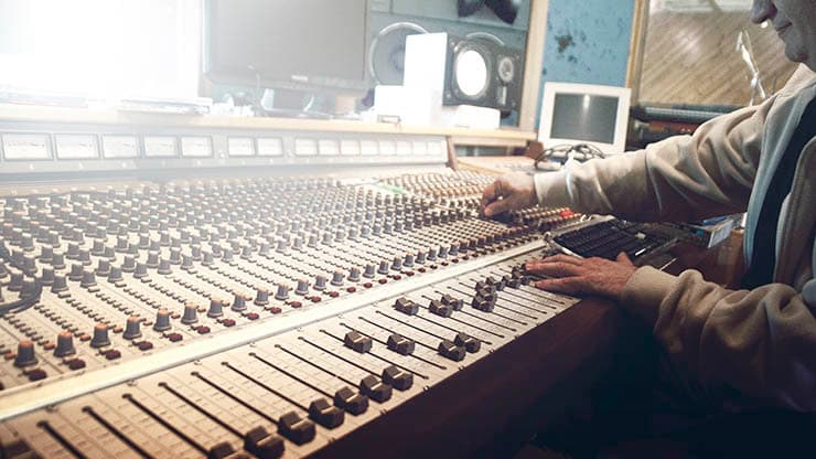 tips-for-live-broadcast-man-on-mixing-desk